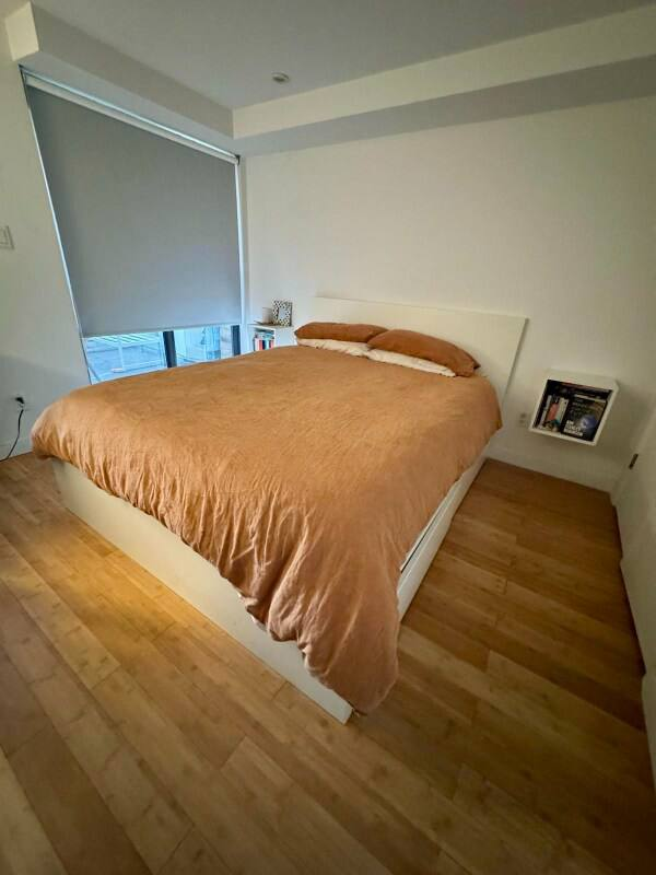 Bedroom with large window and neutral tones