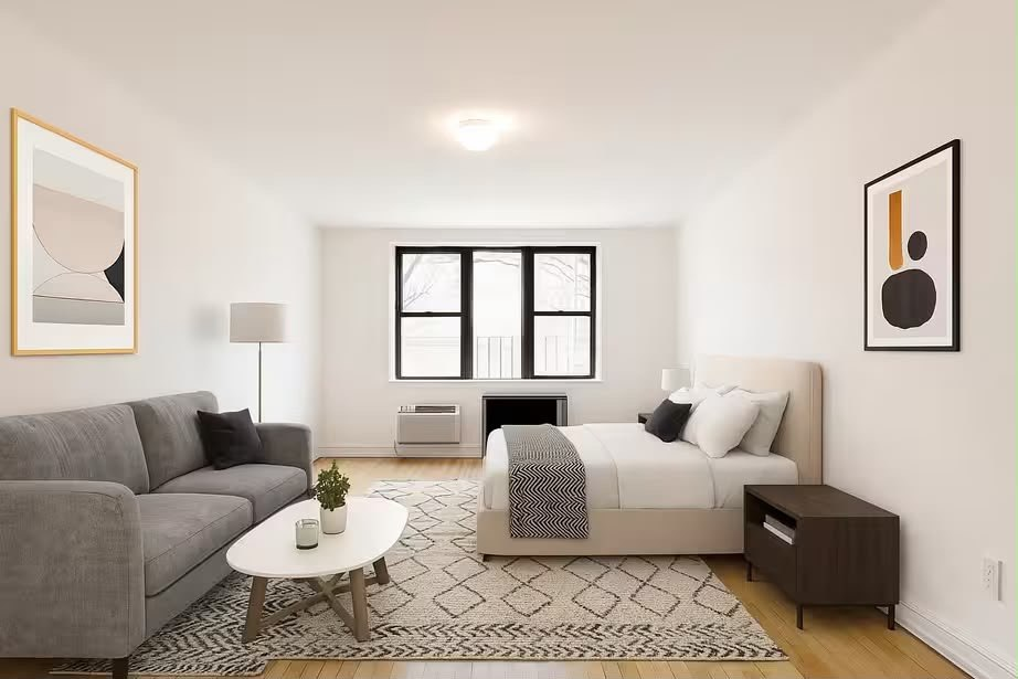 Furnished living and bedroom area in the Valley Stream garden apartment